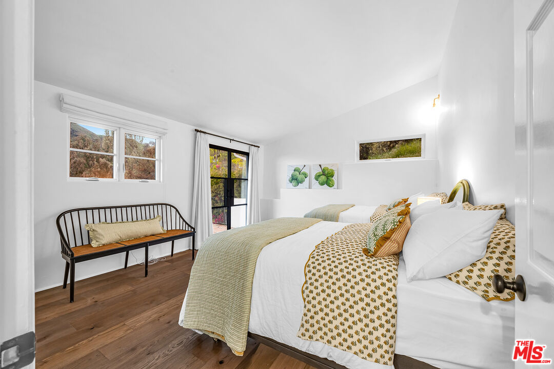 2382 Live Oak Meadows Road Malibu, CA 90265 - Photo 13 of 20 a bedroom with a bed and a couch
