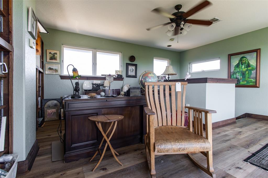 1775 Sunset Mountain Road Lipan, TX 76462 - Photo 21 of 34 a view of a livingroom with furniture window and wooden floor