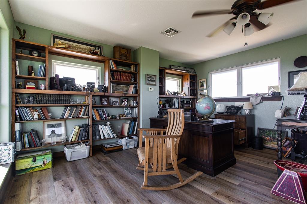 1775 Sunset Mountain Road Lipan, TX 76462 - Photo 22 of 34 a view of a livingroom with furniture hardwood and windows