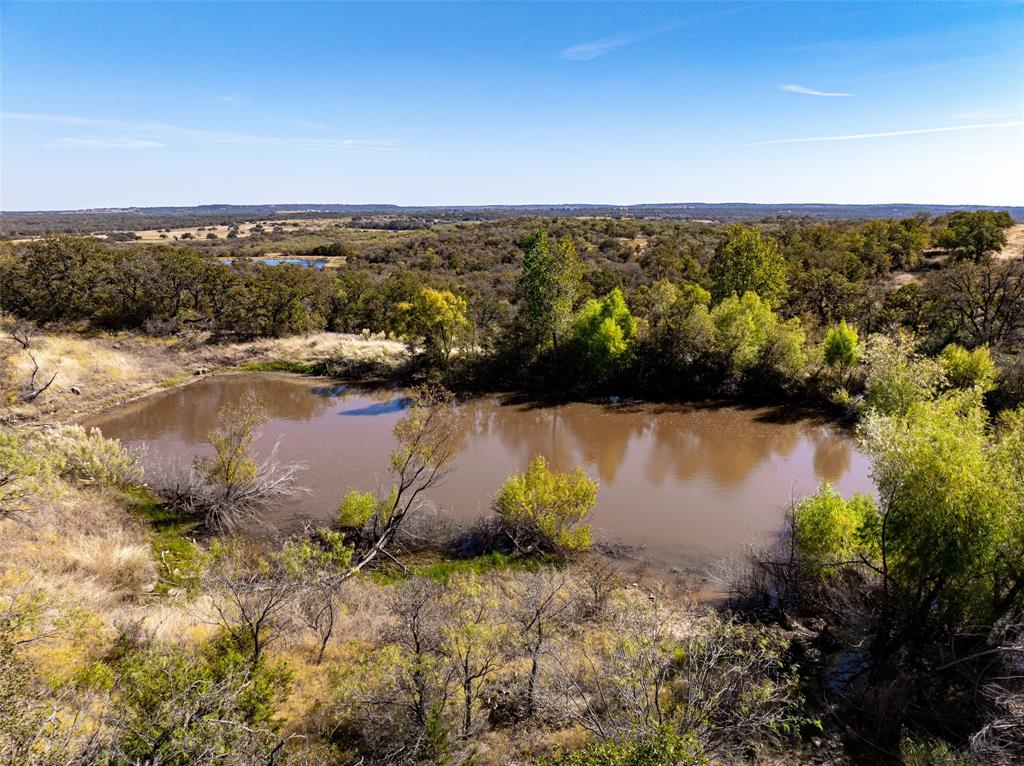 1775 Sunset Mountain Road Lipan, TX 76462 - Photo 4 of 34 an aerial view of residential building and lake