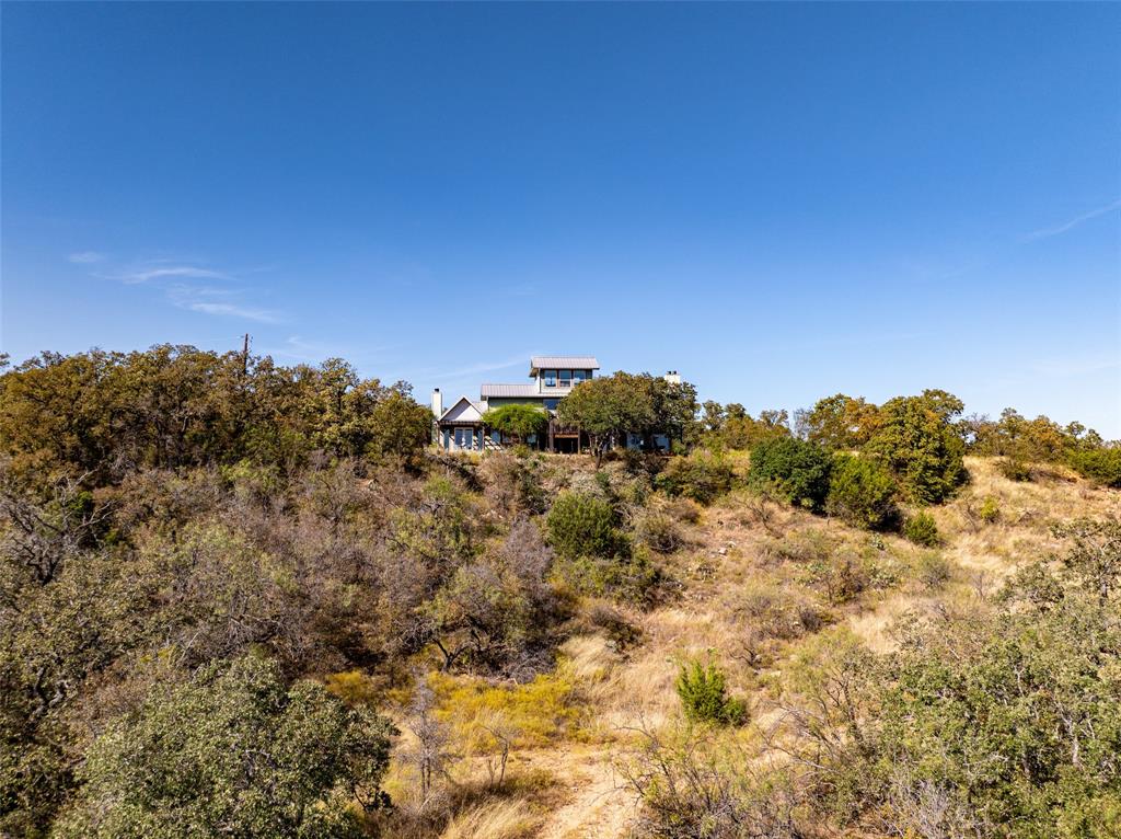 1775 Sunset Mountain Road Lipan, TX 76462 - Photo 5 of 34 a view of a building