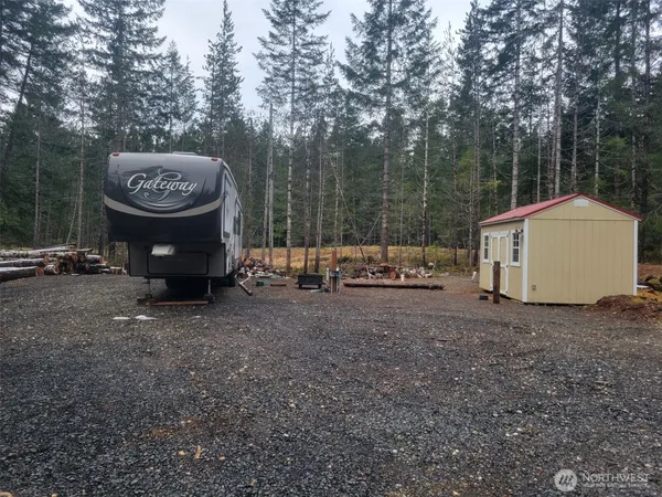 a view of a barn in a yard