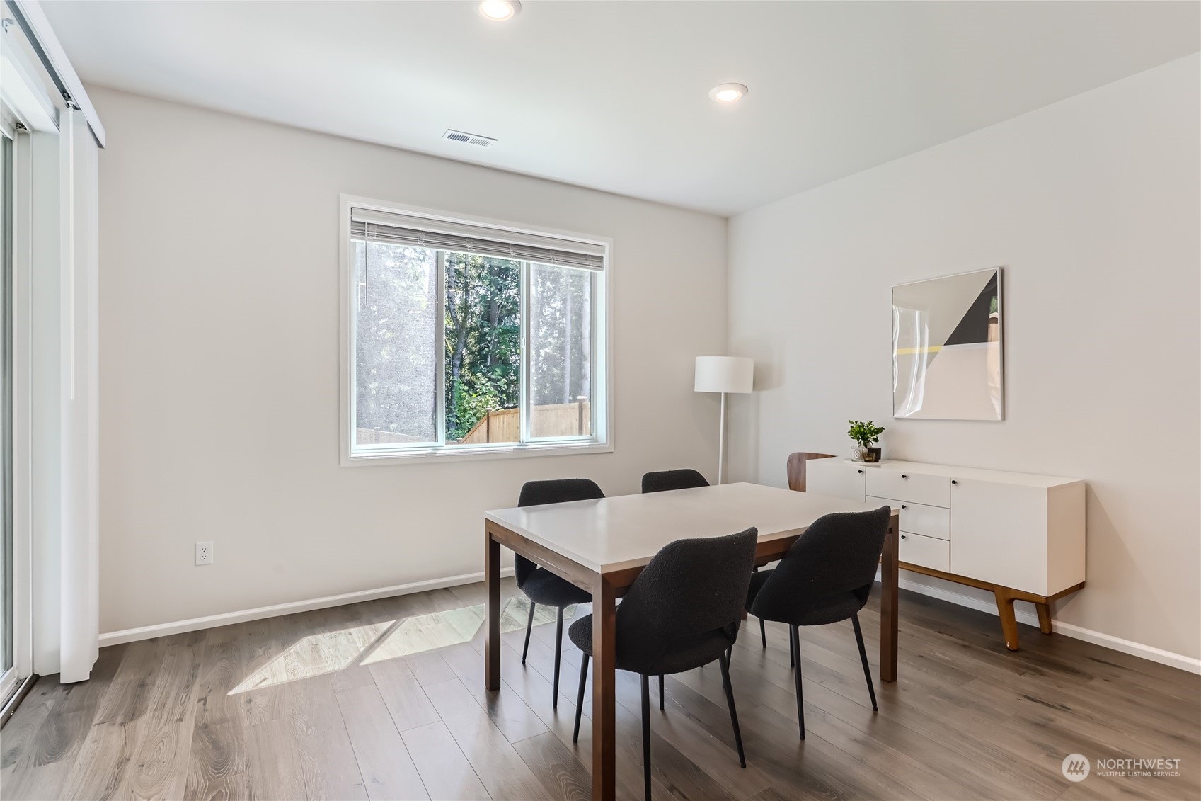 4126 235th Place Southeast Bothell, WA 98021 - Photo 14 of 28 a view of a dining room with furniture and wooden floor
