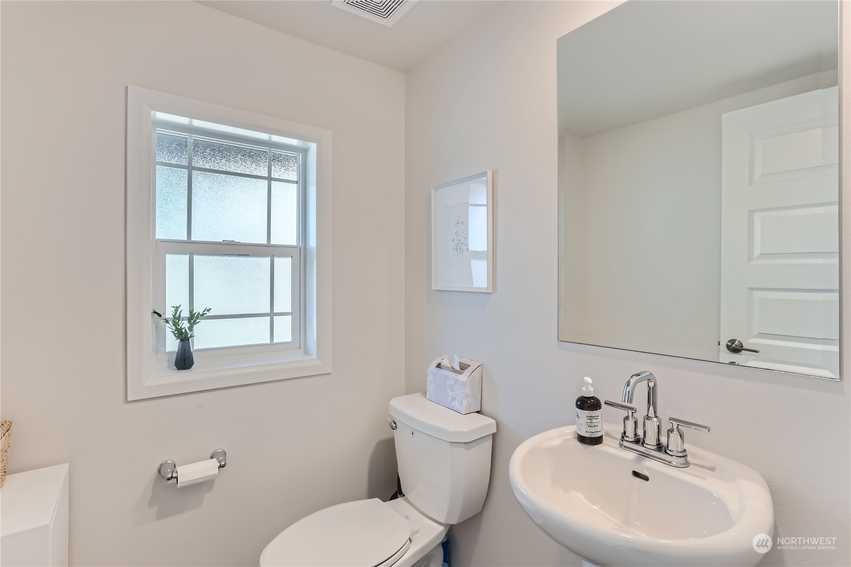 4126 235th Place Southeast Bothell, WA 98021 - Photo 15 of 28 a bathroom with a toilet a sink and mirror