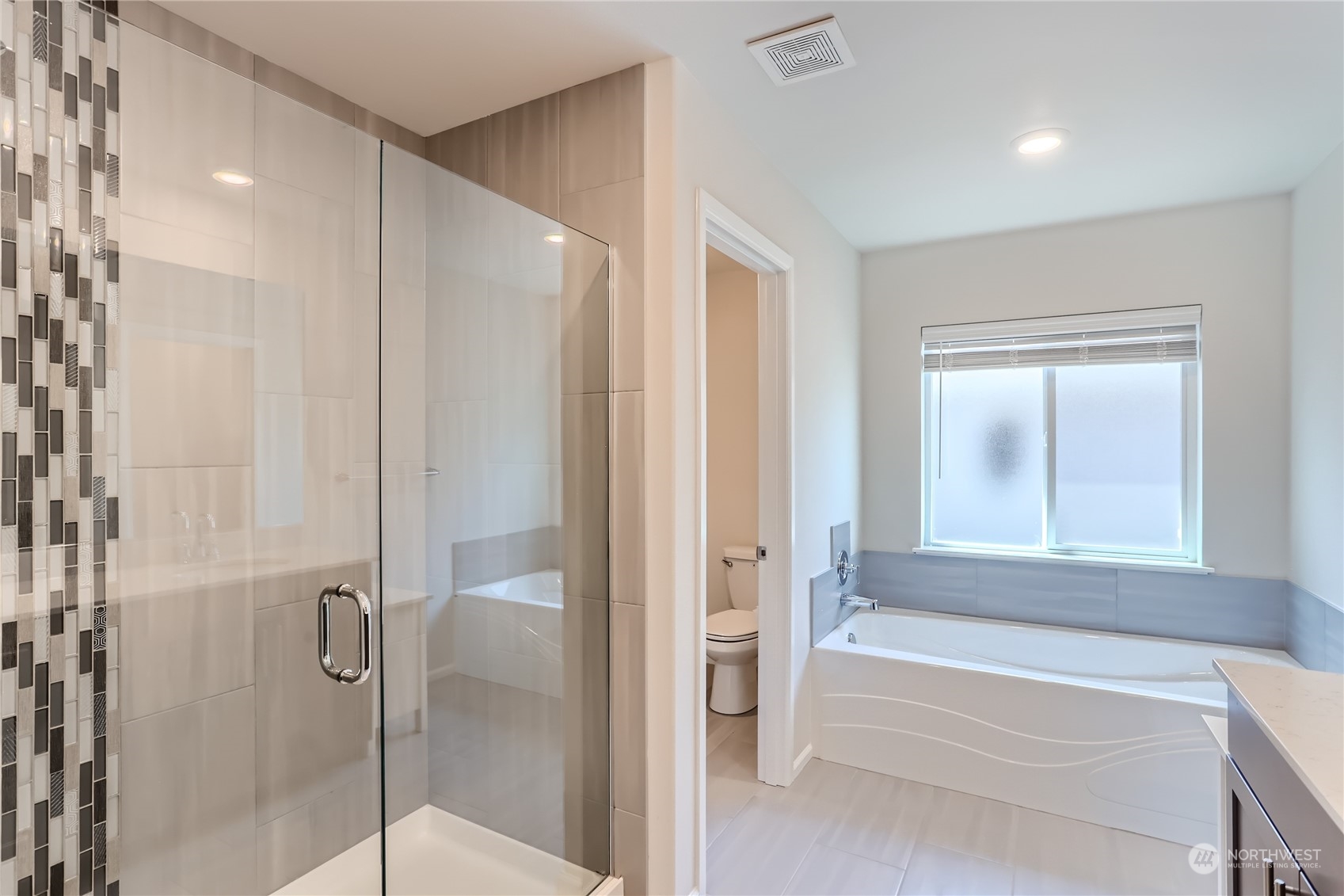 4126 235th Place Southeast Bothell, WA 98021 - Photo 19 of 28 a bathroom with a bathtub and a shower