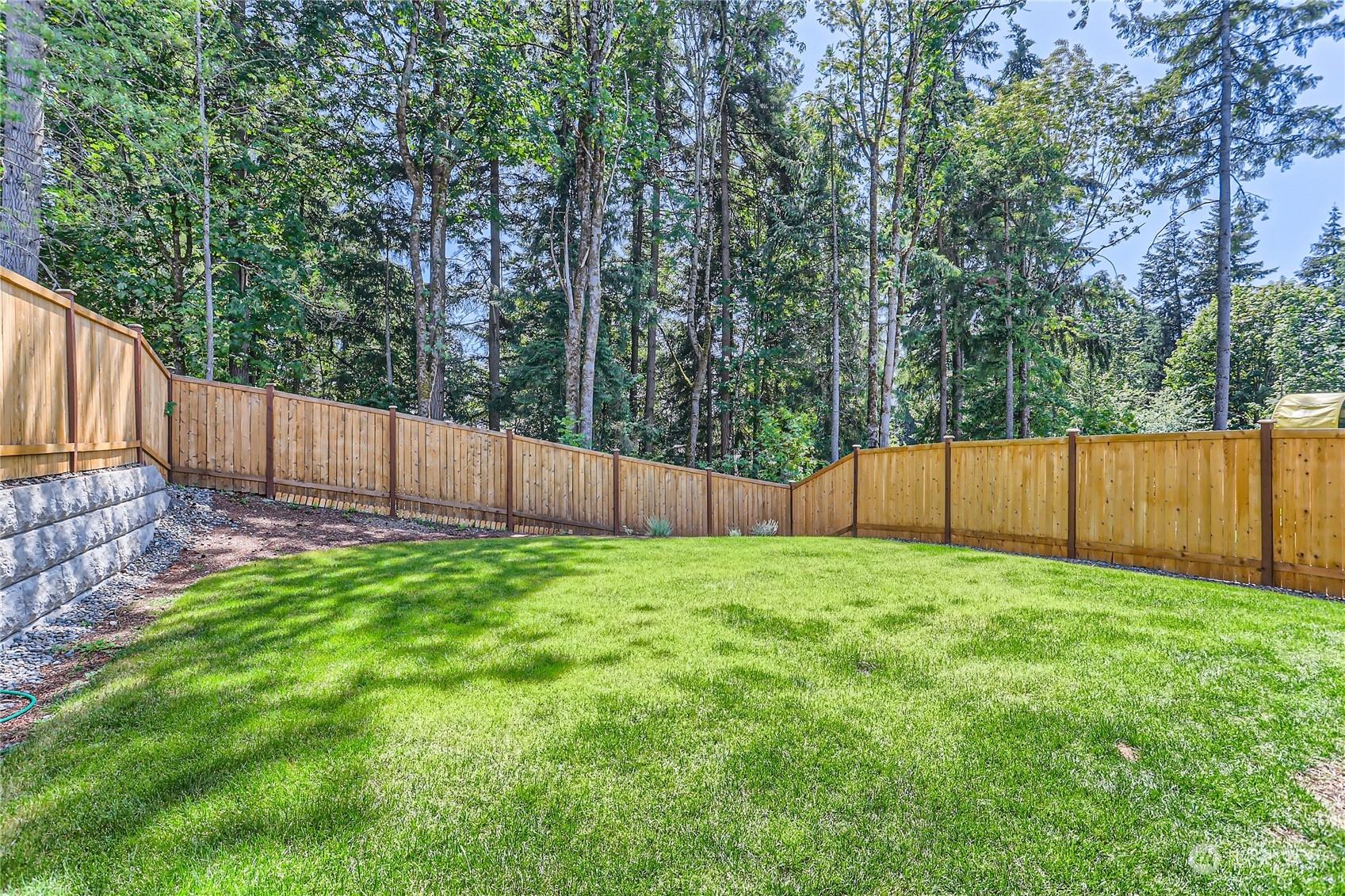 4126 235th Place Southeast Bothell, WA 98021 - Photo 27 of 28 a view of a yard with wooden fence