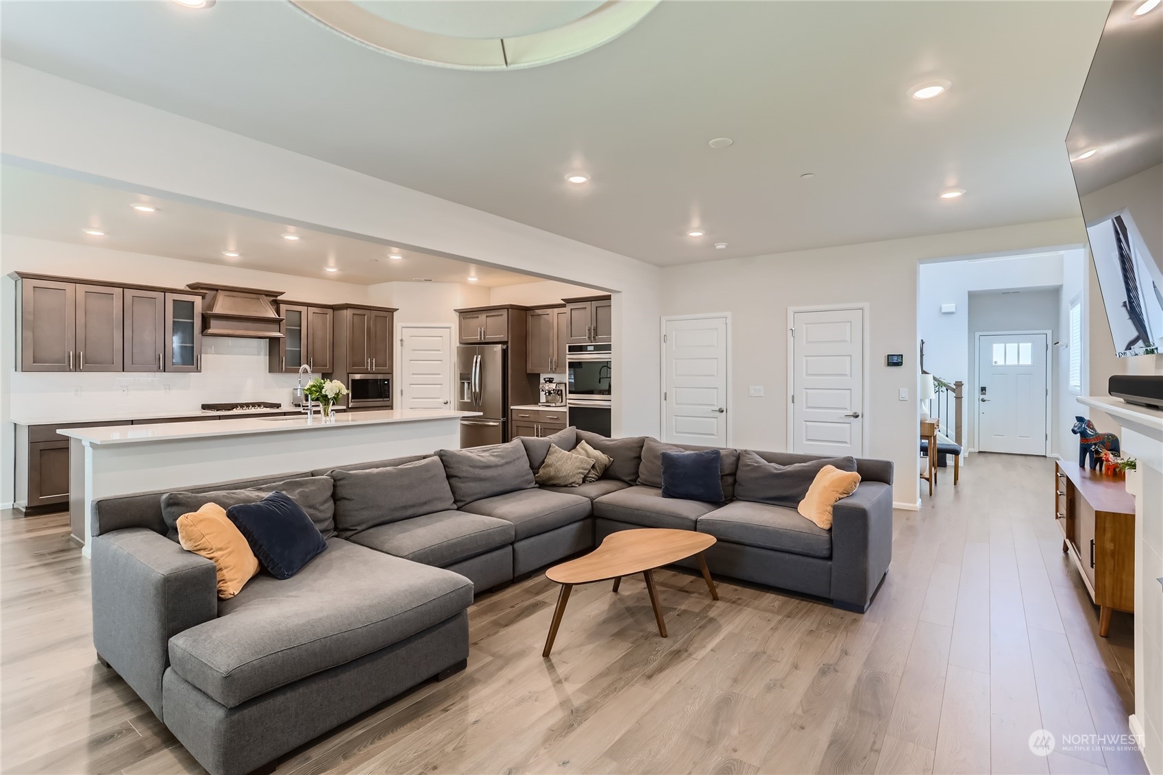 4126 235th Place Southeast Bothell, WA 98021 - Photo 6 of 28 a living room with furniture and kitchen view