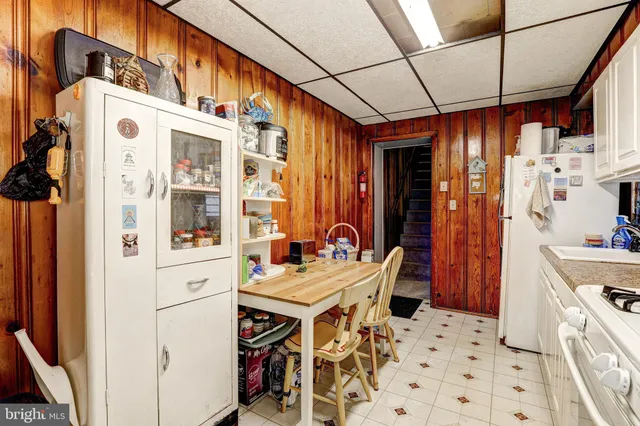 a view of a dinning room with furniture and window