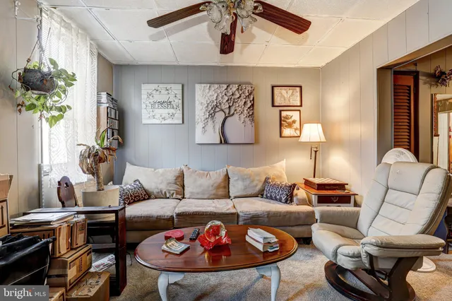 a living room with furniture and a rug