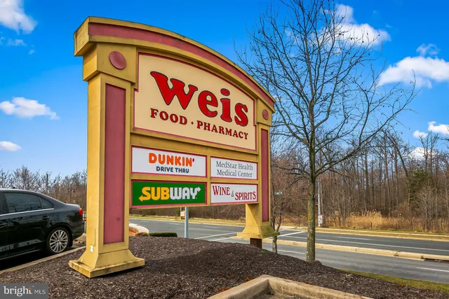 a sign on a pole on a street