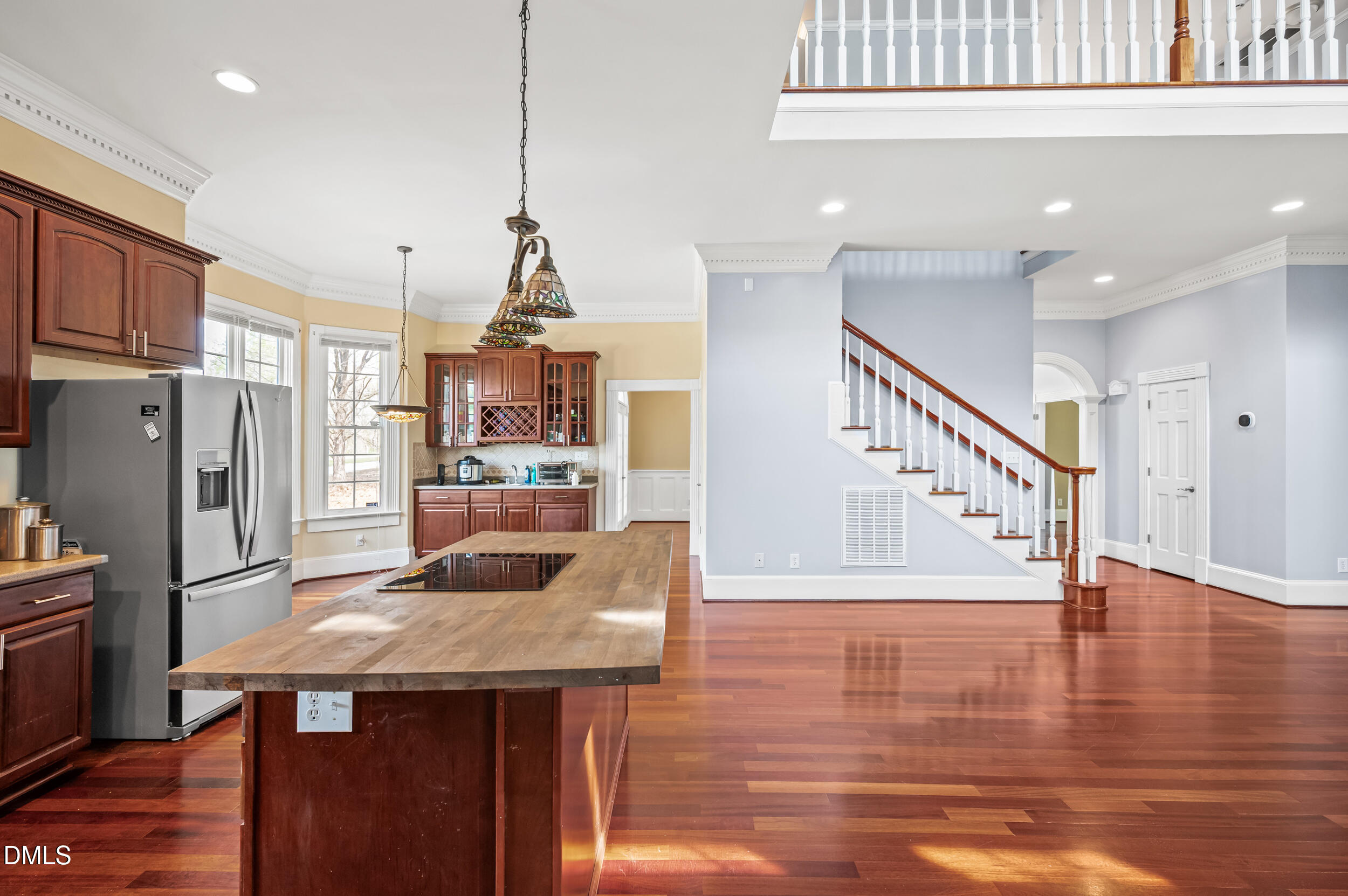 1957 Hilltop Road Raleigh, NC 27610 - Photo 13 of 46 a kitchen with stainless steel appliances kitchen island granite countertop a refrigerator a stove and a wooden floors
