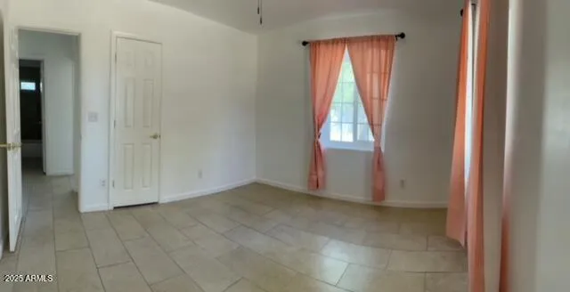 a view of an empty room and window
