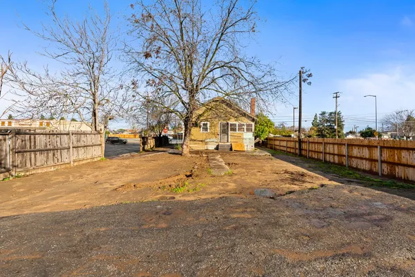a street view with wooden fence