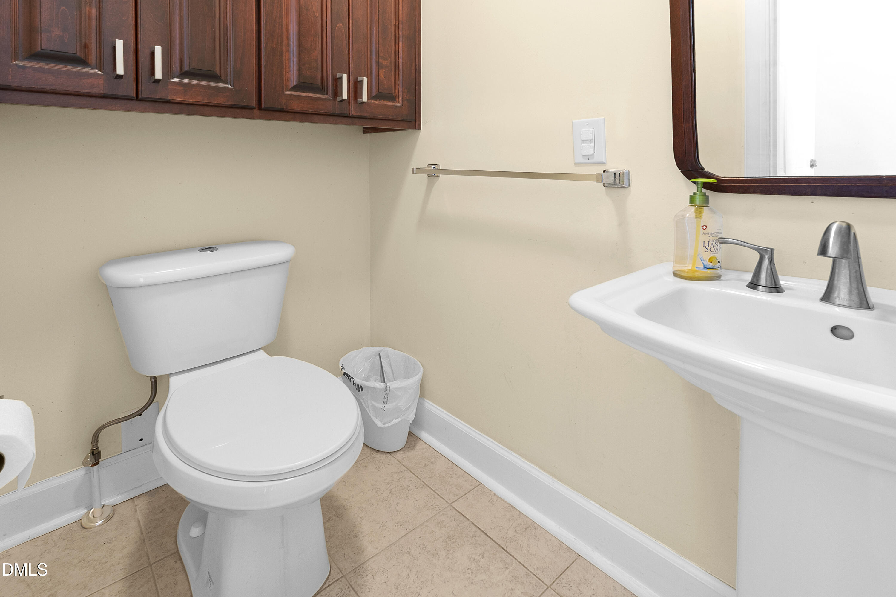 5575 Straw Pond School Road Godwin, NC 28344 - Photo 21 of 66 a bathroom with a toilet sink and mirror