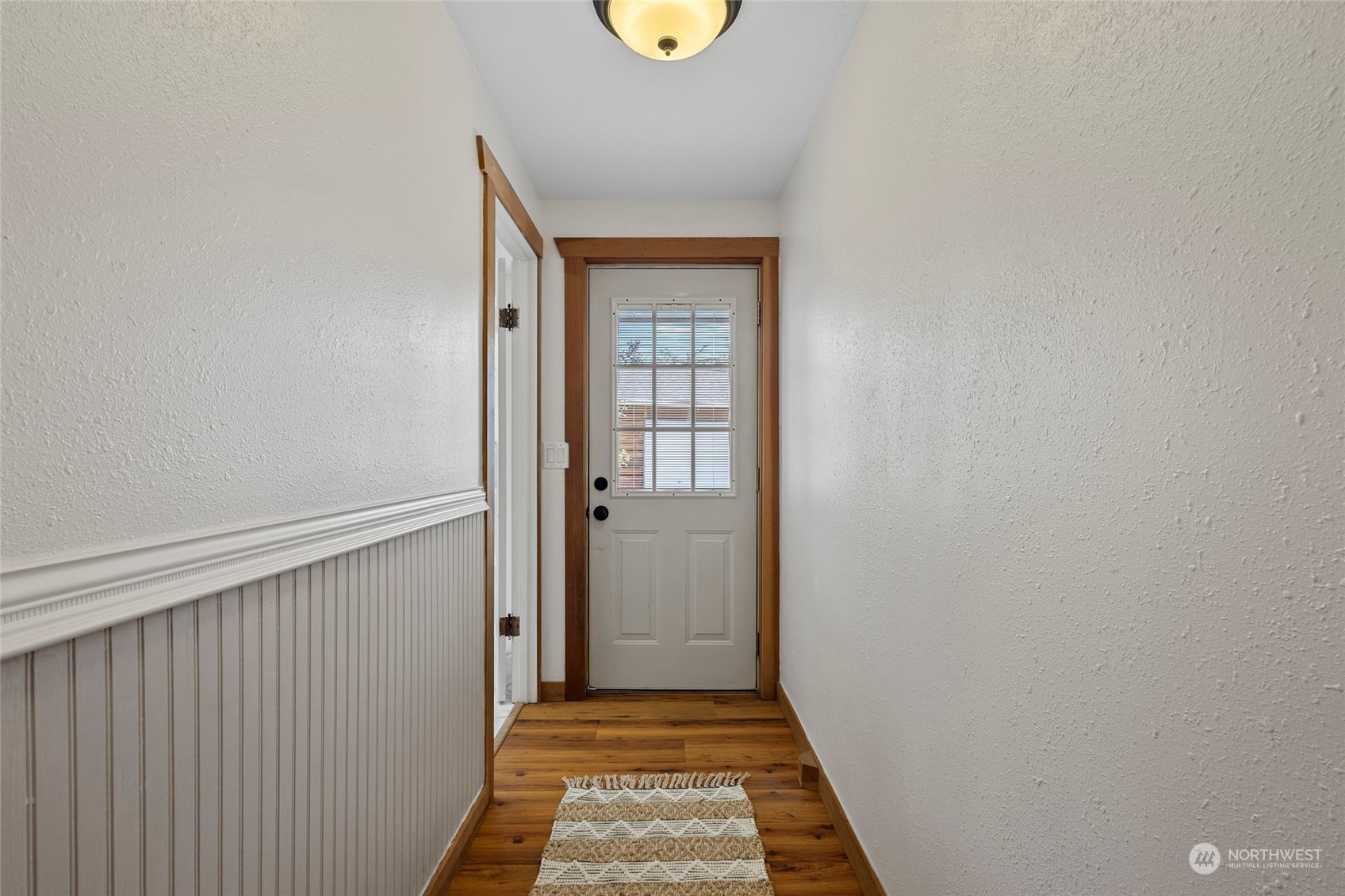 1305 Gohr Road Sultan, WA 98294 - Photo 14 of 27 a view of a hallway with wooden floor
