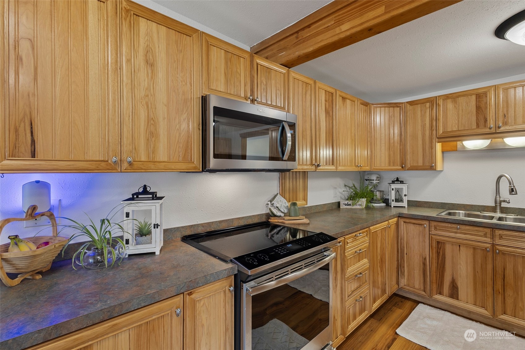 1305 Gohr Road Sultan, WA 98294 - Photo 3 of 27 a kitchen with stainless steel appliances granite countertop a sink a stove and a microwave