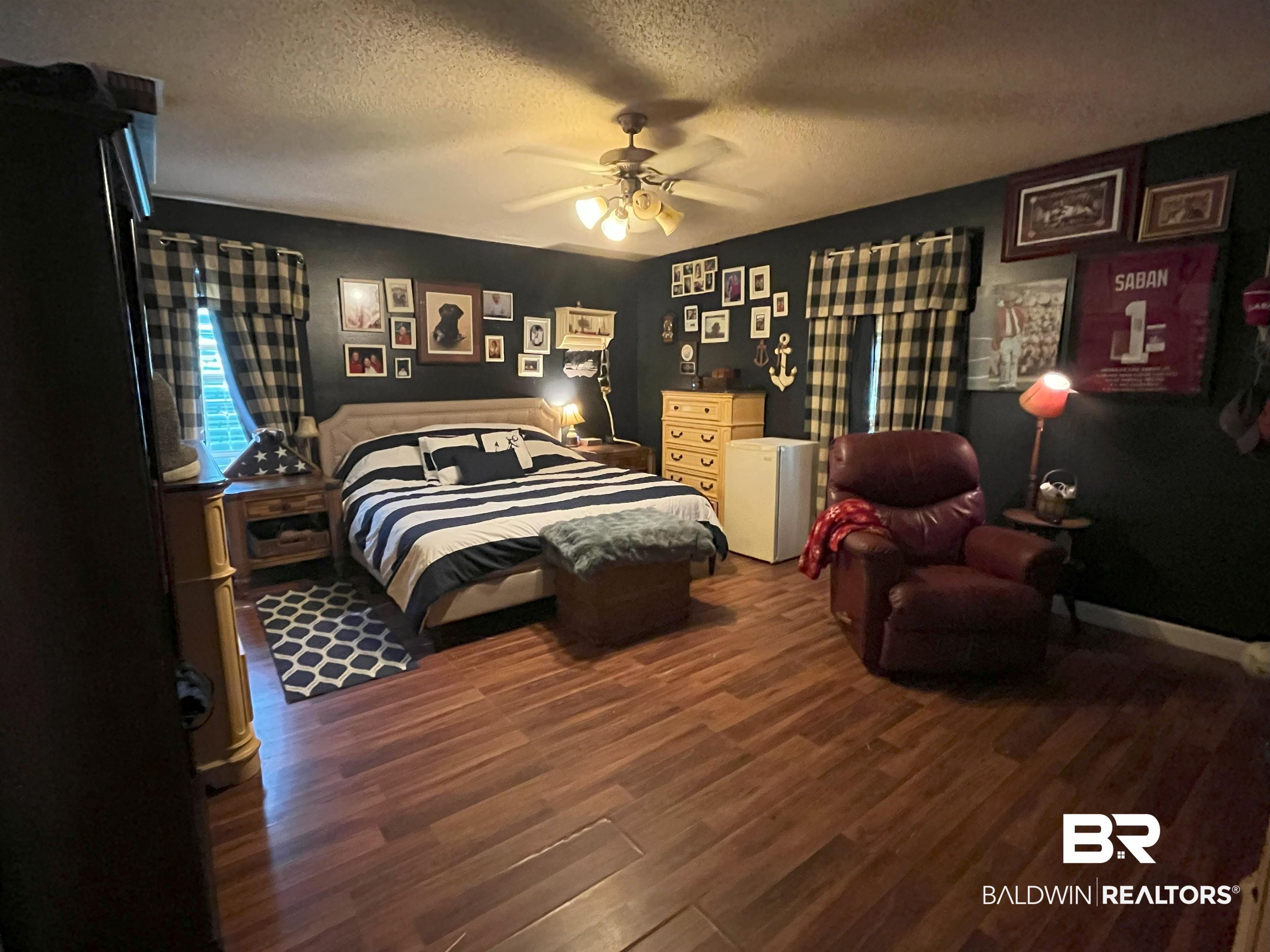 7851 Highway 98 Fairhope, AL 36532 - Photo 21 of 40 Bedroom featuring a textured ceiling, wood finished floors, and ceiling fan