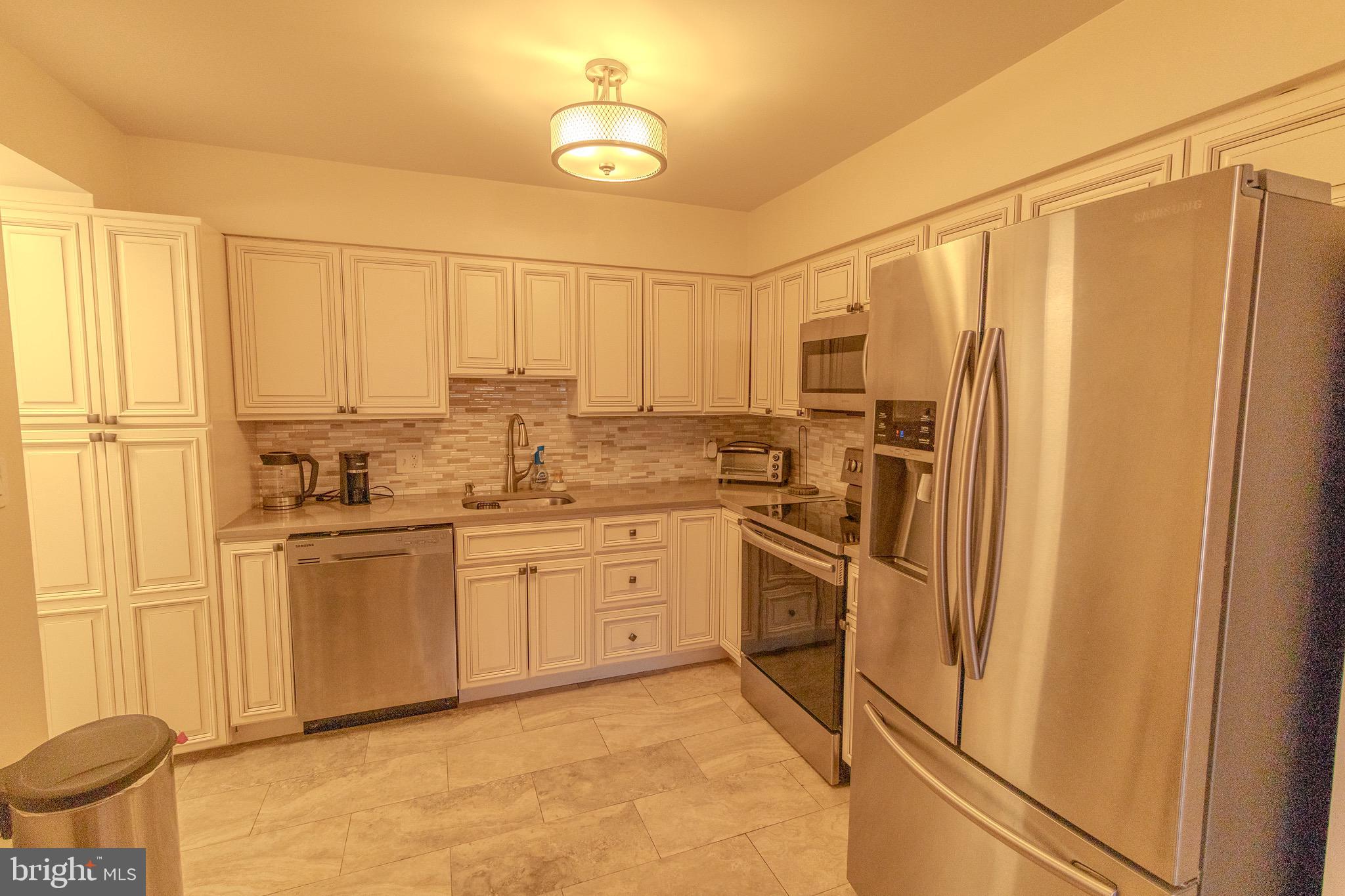 1808 Old Meadow Road, Unit 112 McLean, VA 22102 - Photo 9 of 20 Modern kitchen with sleek stainless finishes.