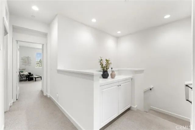 a bedroom with a bed furniture chandelier and a window