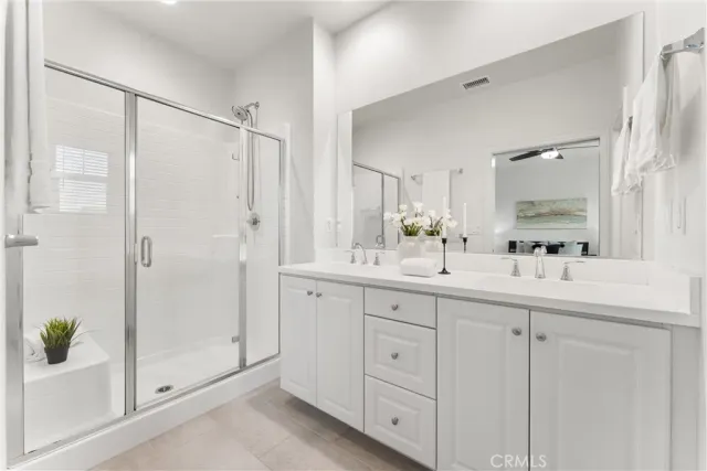 a bathroom with a shower and a sink