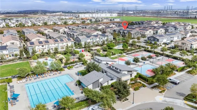 an aerial view of residential houses with outdoor space