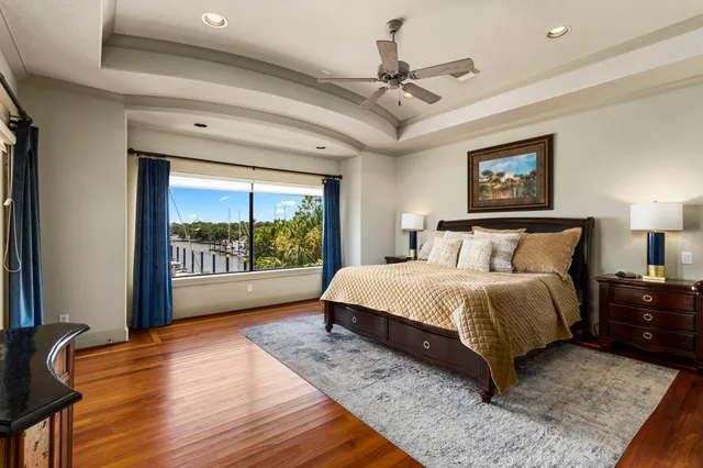 a spacious bedroom with a bed and a window