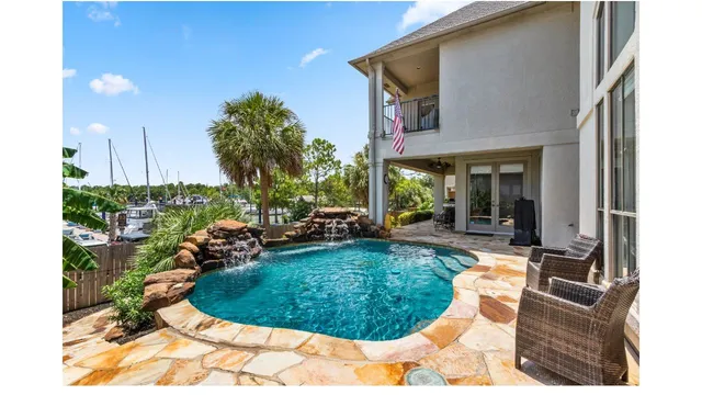 a view of a swimming pool with a patio