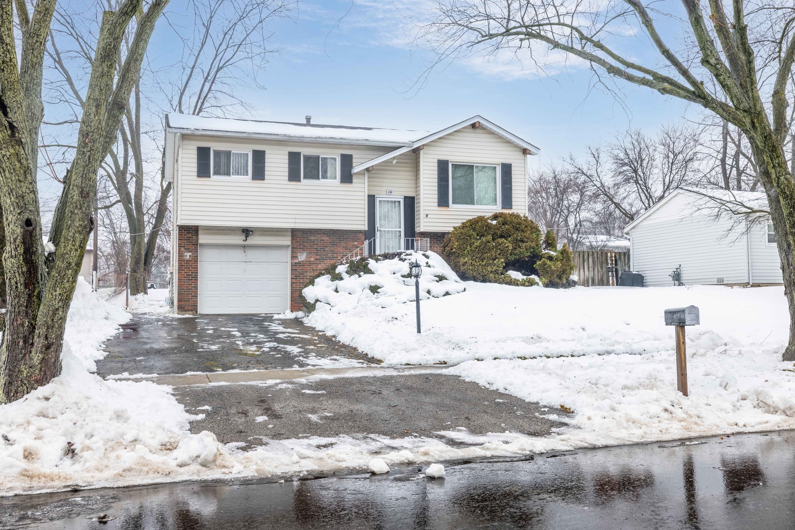 332 Hadleigh Road Bolingbrook, IL 60440 - Photo 1 of 16 a view of a house with snow on the background