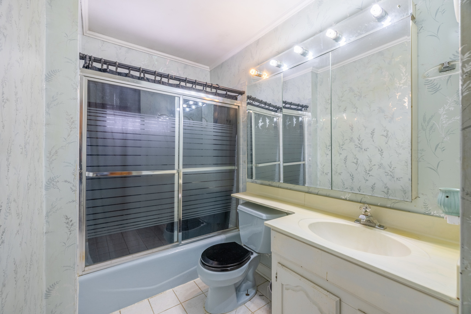 332 Hadleigh Road Bolingbrook, IL 60440 - Photo 8 of 16 a bathroom with a sink a toilet and shower
