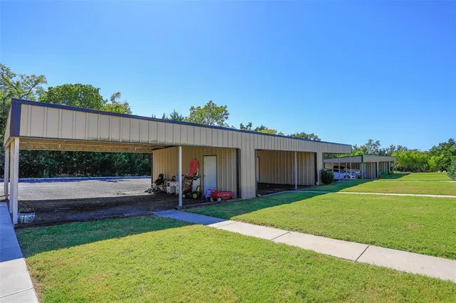 a view of backyard with potted plants