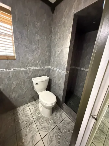 a bathroom with a toilet and a vanity