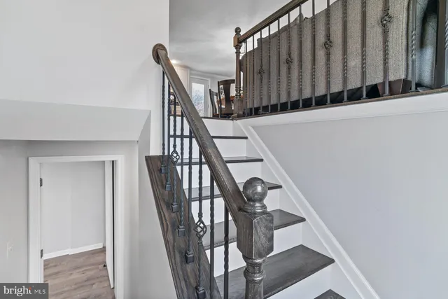 a view of a house with swimming pool and a yard