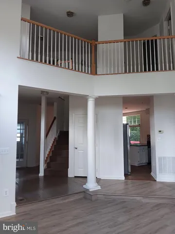 a view of staircase with white walls and stairs