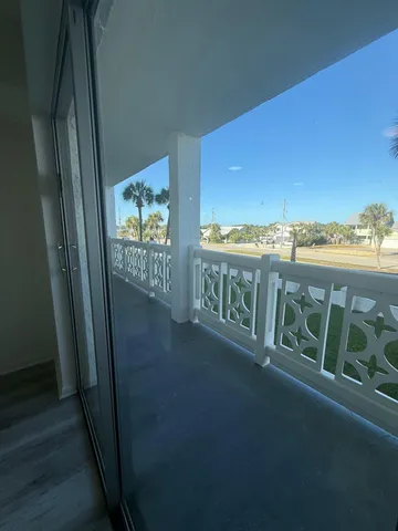 a view of balcony with furniture