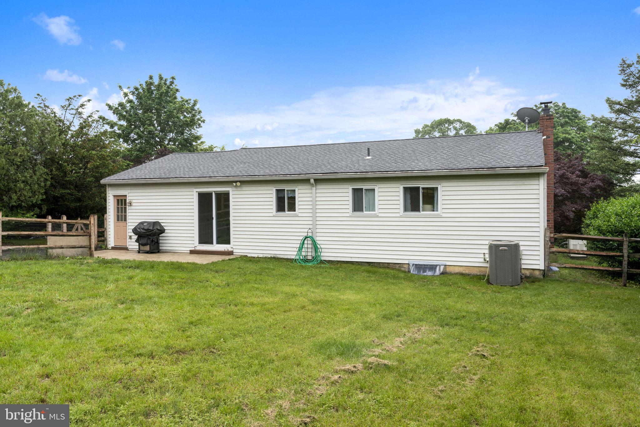 3019 Appledale Road Eagleville, PA 19403 - Photo 33 of 36 a view of a house with a backyard and chairs