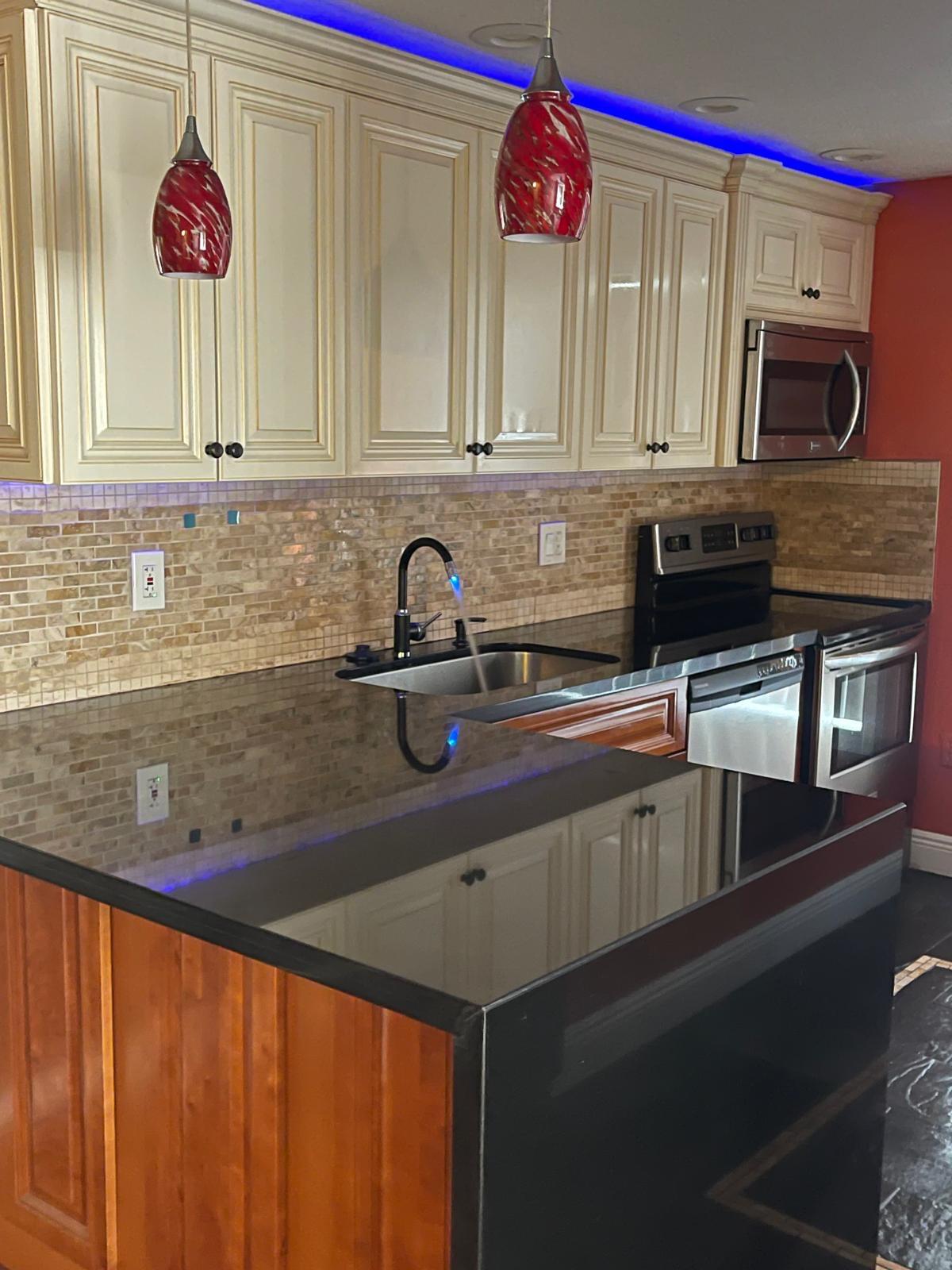 a kitchen with a sink cabinets and a microwave