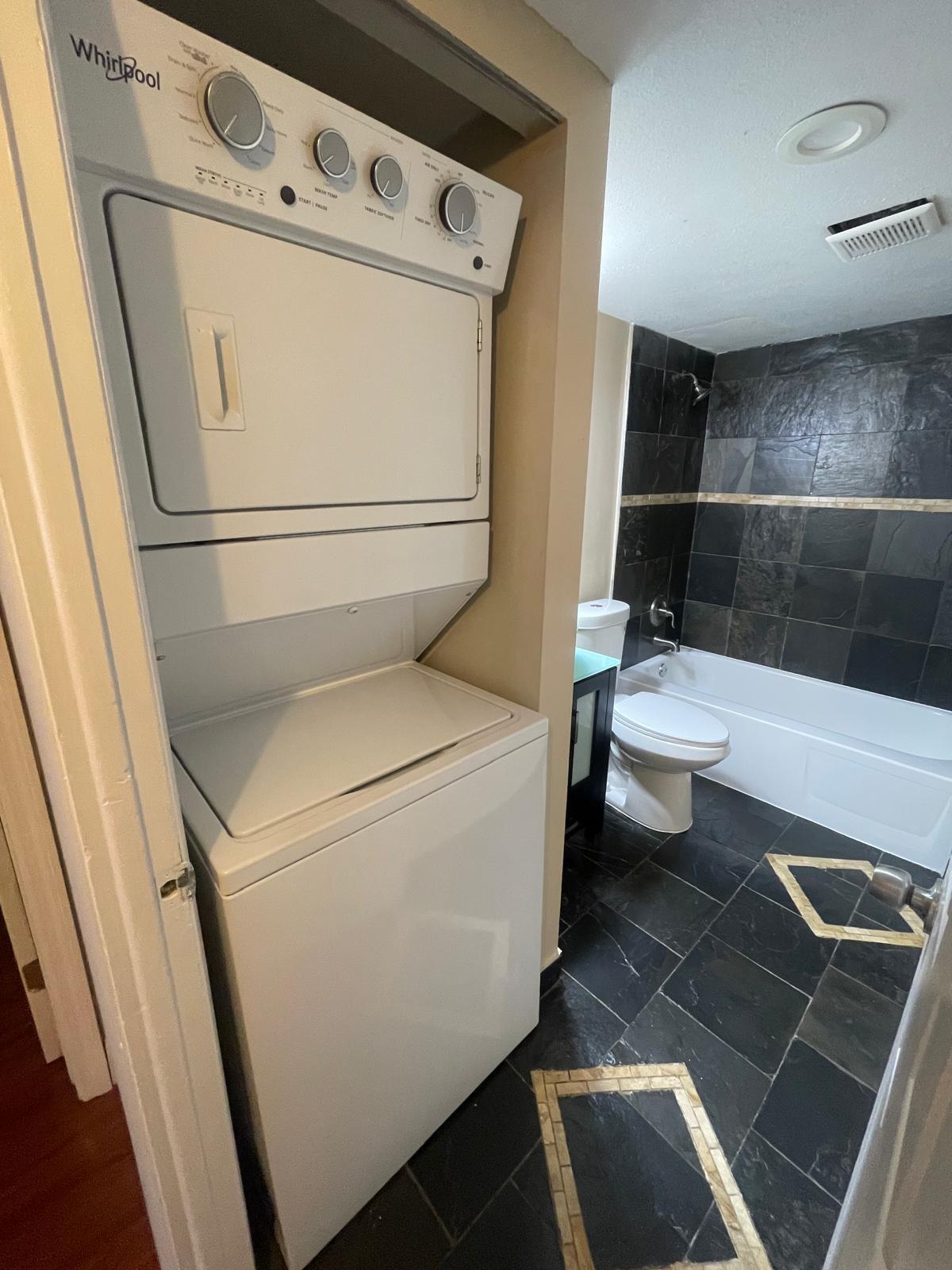4156 Inverrary Drive, Unit 202 Lauderhill, FL 33319 - Photo 13 of 14 a white toilet sitting next to a bathroom sink