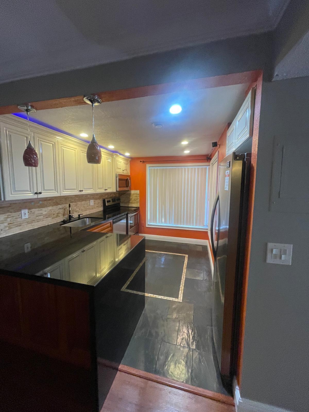 4156 Inverrary Drive, Unit 202 Lauderhill, FL 33319 - Photo 2 of 14 a view of kitchen with stainless steel appliances granite countertop a sink and a refrigerator