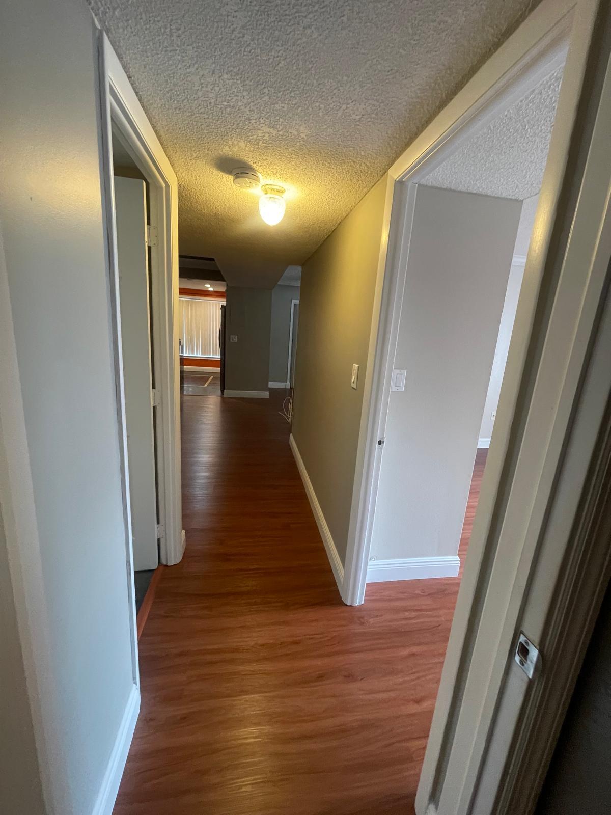 4156 Inverrary Drive, Unit 202 Lauderhill, FL 33319 - Photo 5 of 14 a view of a hallway with wooden floor
