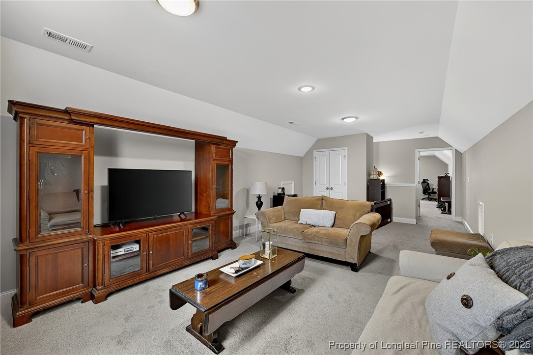 193 Rocking Horse Lane Raeford, NC 28376 - Photo 19 of 25 a living room with furniture and a flat screen tv