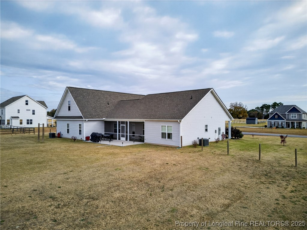 193 Rocking Horse Lane Raeford, NC 28376 - Photo 2 of 25 a view of a house with a yard and sitting area