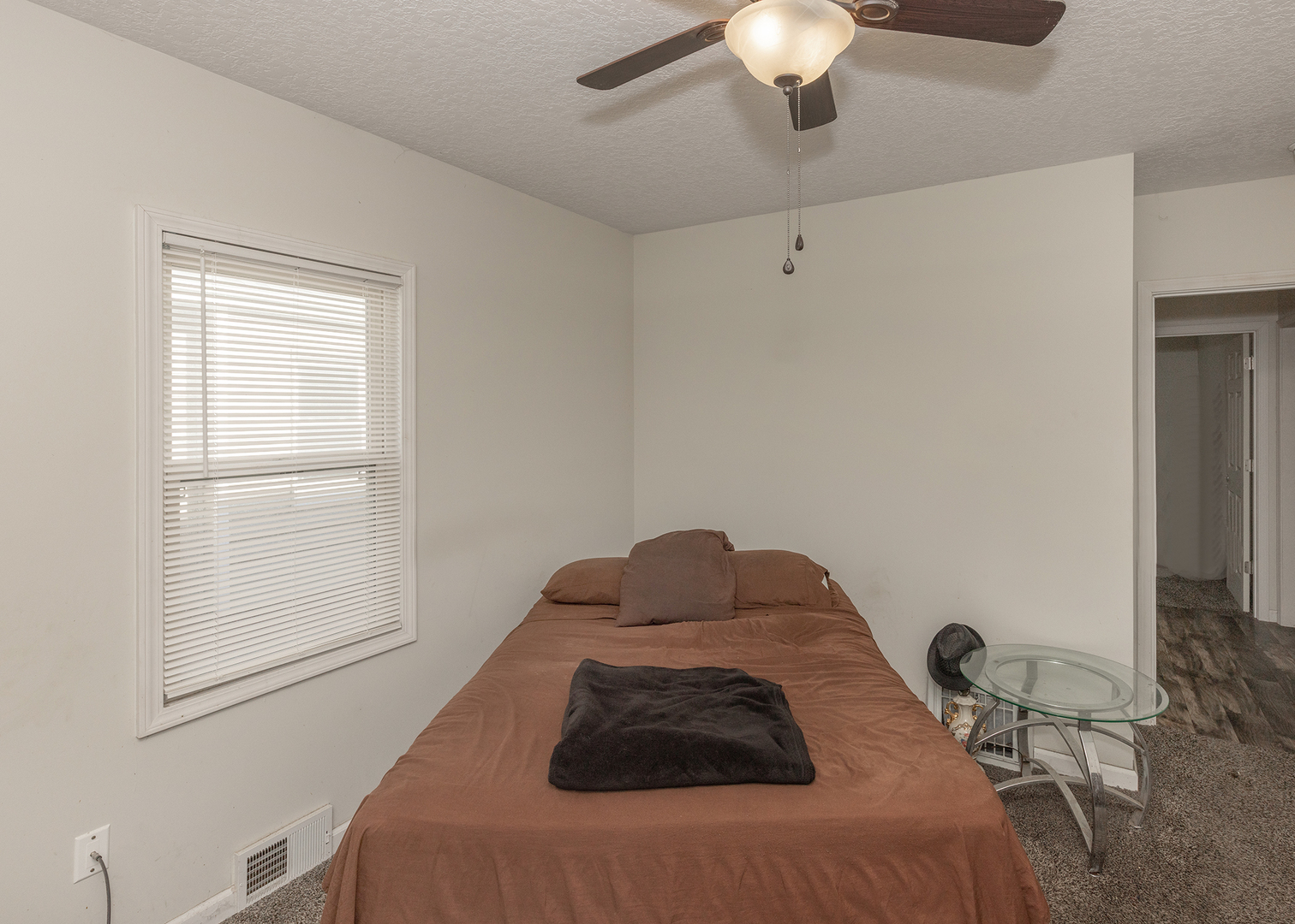 1717 6th Street Rock Island, IL 61201 - Photo 15 of 25 a bedroom with a bed and a chandelier