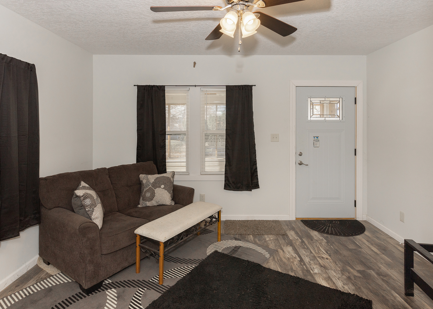 1717 6th Street Rock Island, IL 61201 - Photo 7 of 25 a bedroom with a bed couch and window