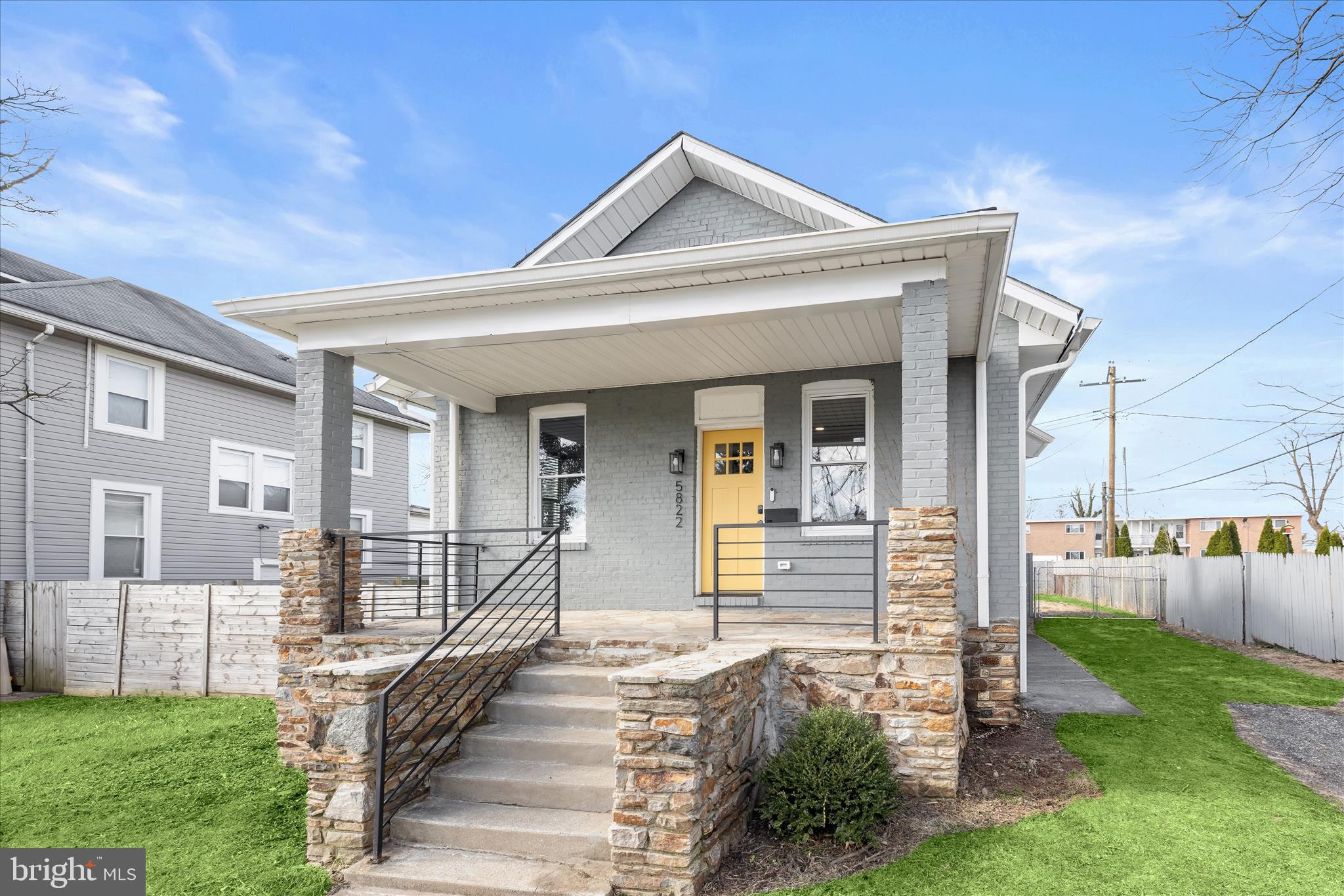 5822 Ethelbert Avenue Baltimore, MD 21215 - Photo 2 of 37 a front view of a house with a porch