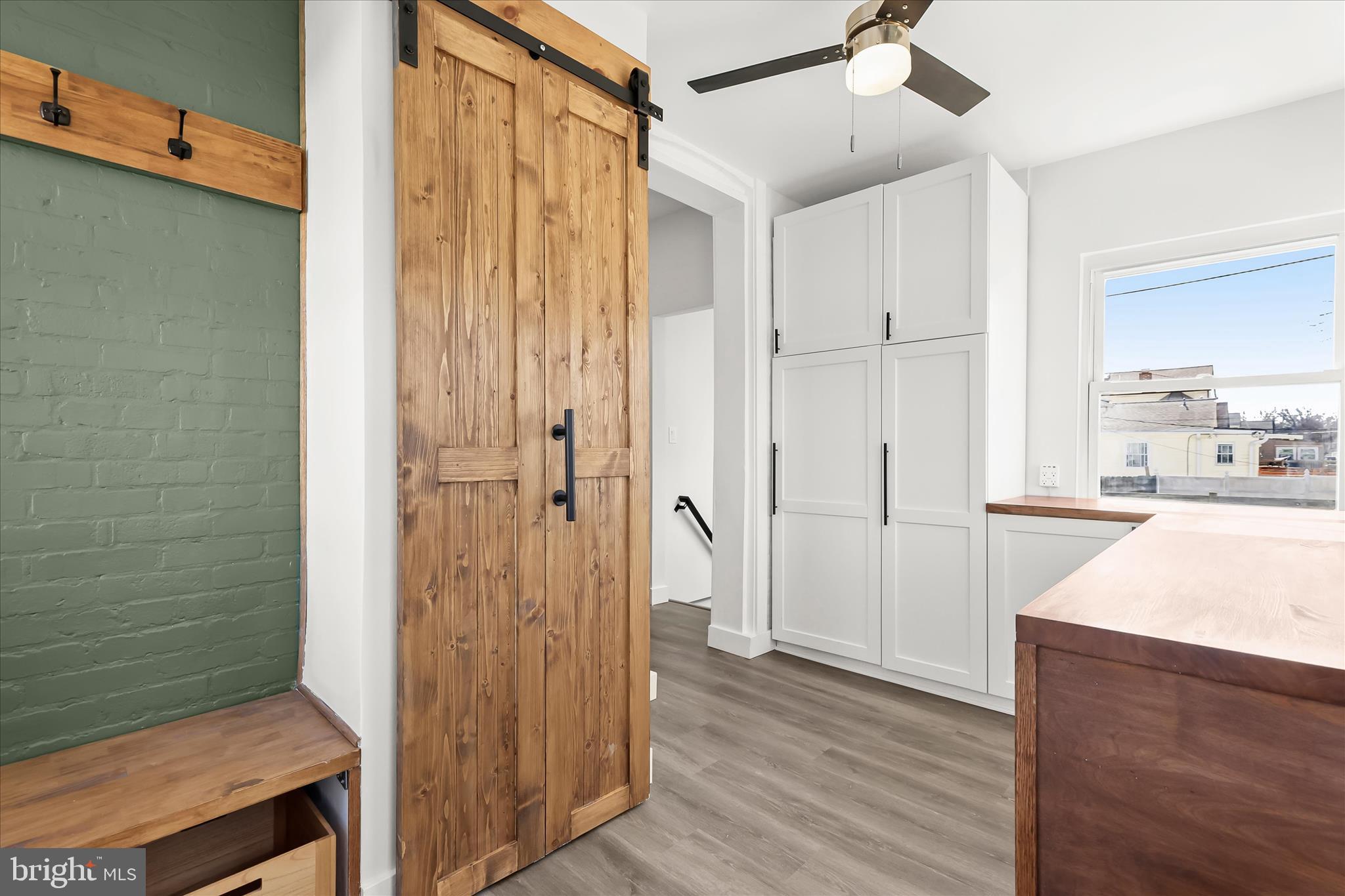 5822 Ethelbert Avenue Baltimore, MD 21215 - Photo 21 of 37 a view of a bathroom with wooden floor and a bathroom