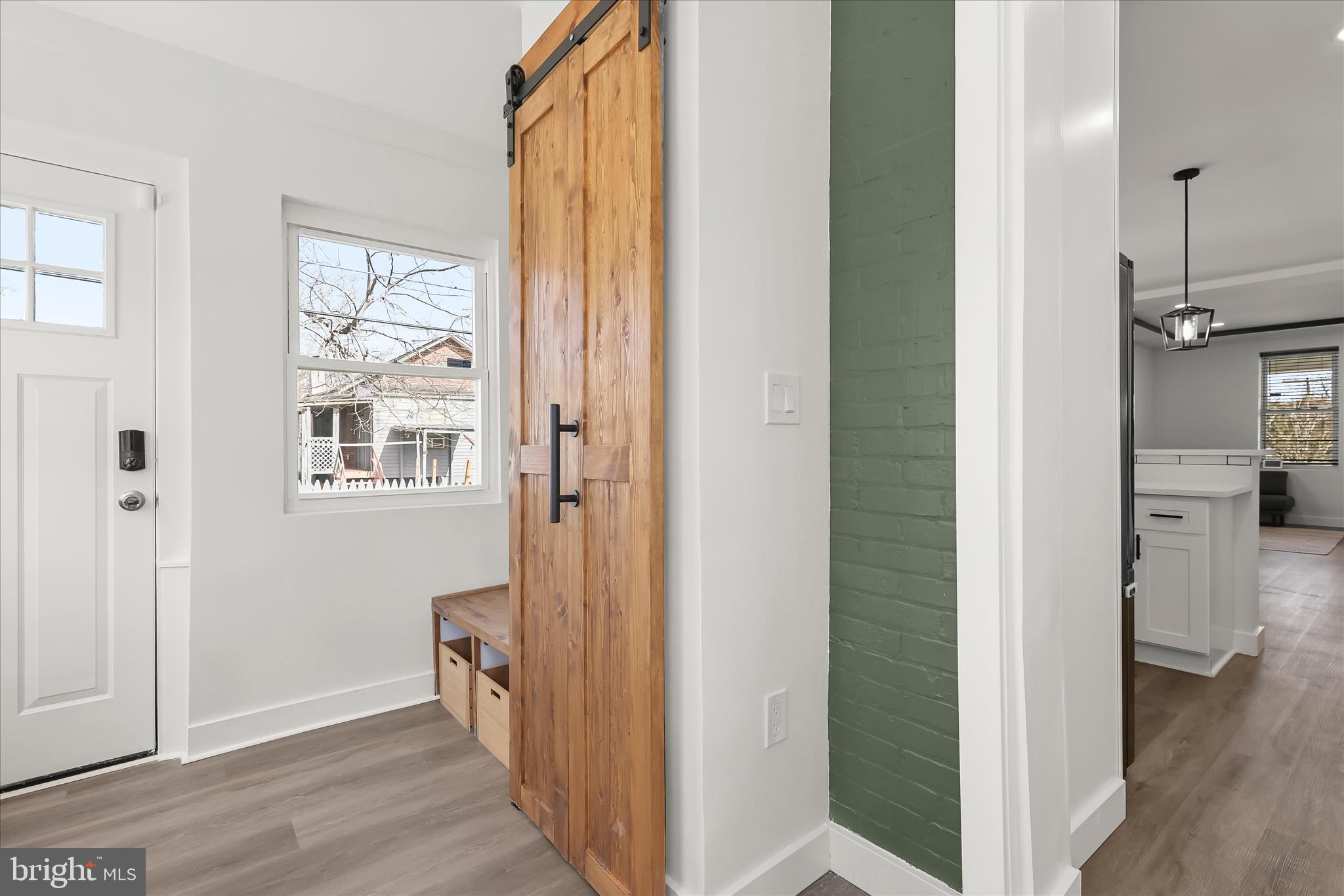 5822 Ethelbert Avenue Baltimore, MD 21215 - Photo 23 of 37 a view of a hallway with wooden floor and entryway
