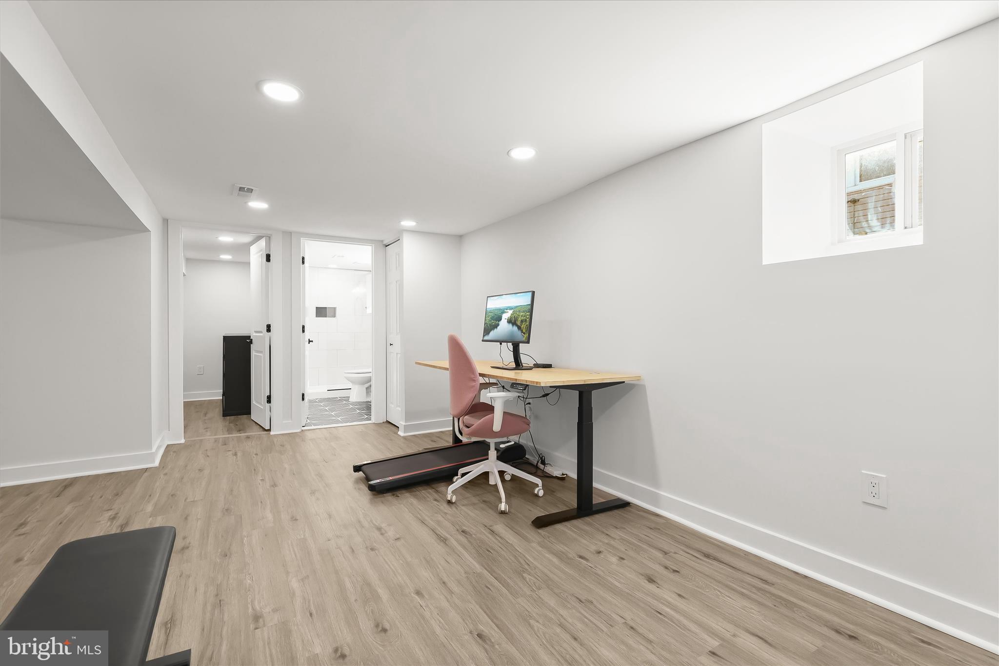 5822 Ethelbert Avenue Baltimore, MD 21215 - Photo 24 of 37 a view of a workspace with furniture and wooden floor