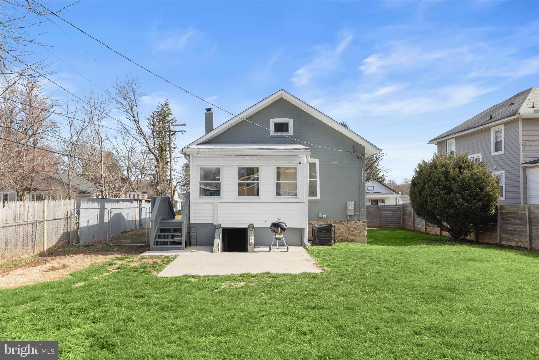 5822 Ethelbert Avenue Baltimore, MD 21215 - Photo 33 of 37 a front view of a house with a yard and trees