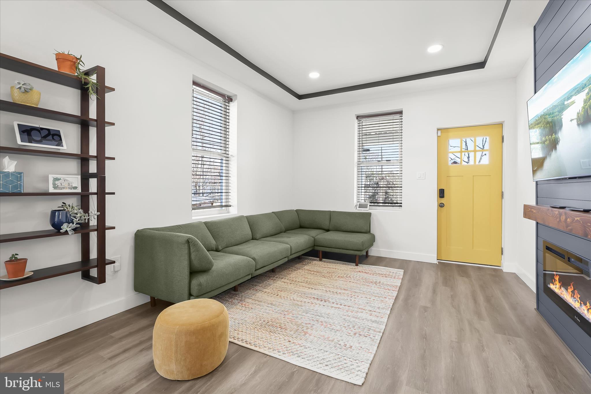 5822 Ethelbert Avenue Baltimore, MD 21215 - Photo 5 of 37 a living room with furniture and a wooden floor