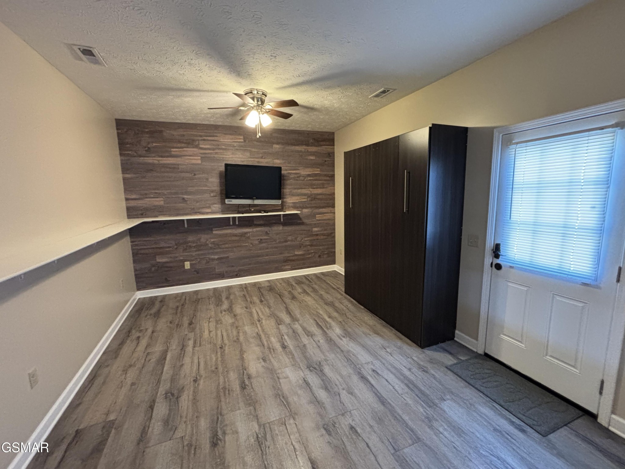 147 Padgett Mill Road Cosby, TN 37722 - Photo 31 of 36 wooden floor in an empty room with a window